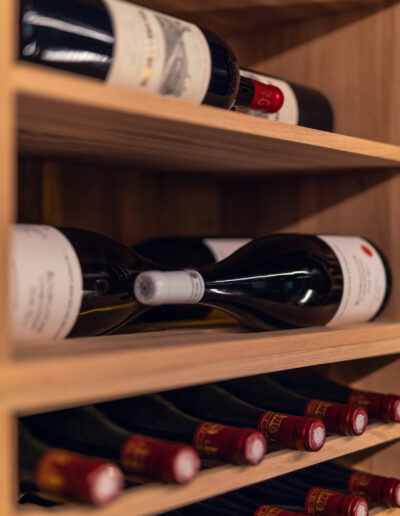 Caverack Magnum shelving system in solid oak from Vinteknikk, designed for exclusive and functional wine storage with precise lines and solid construction.