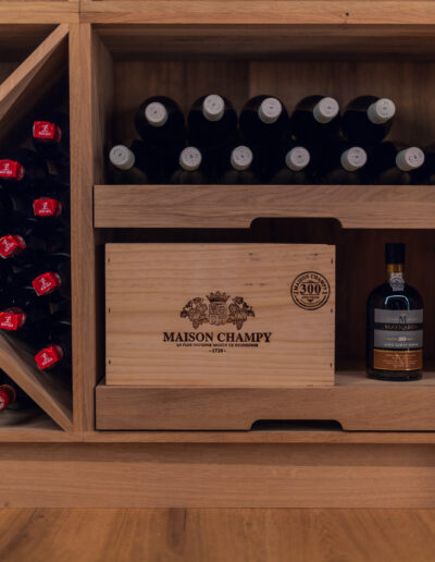 Caverack shelf for wine cases in solid oak, designed and supplied by Vinteknikk, with precise lines and craftsmanship execution.